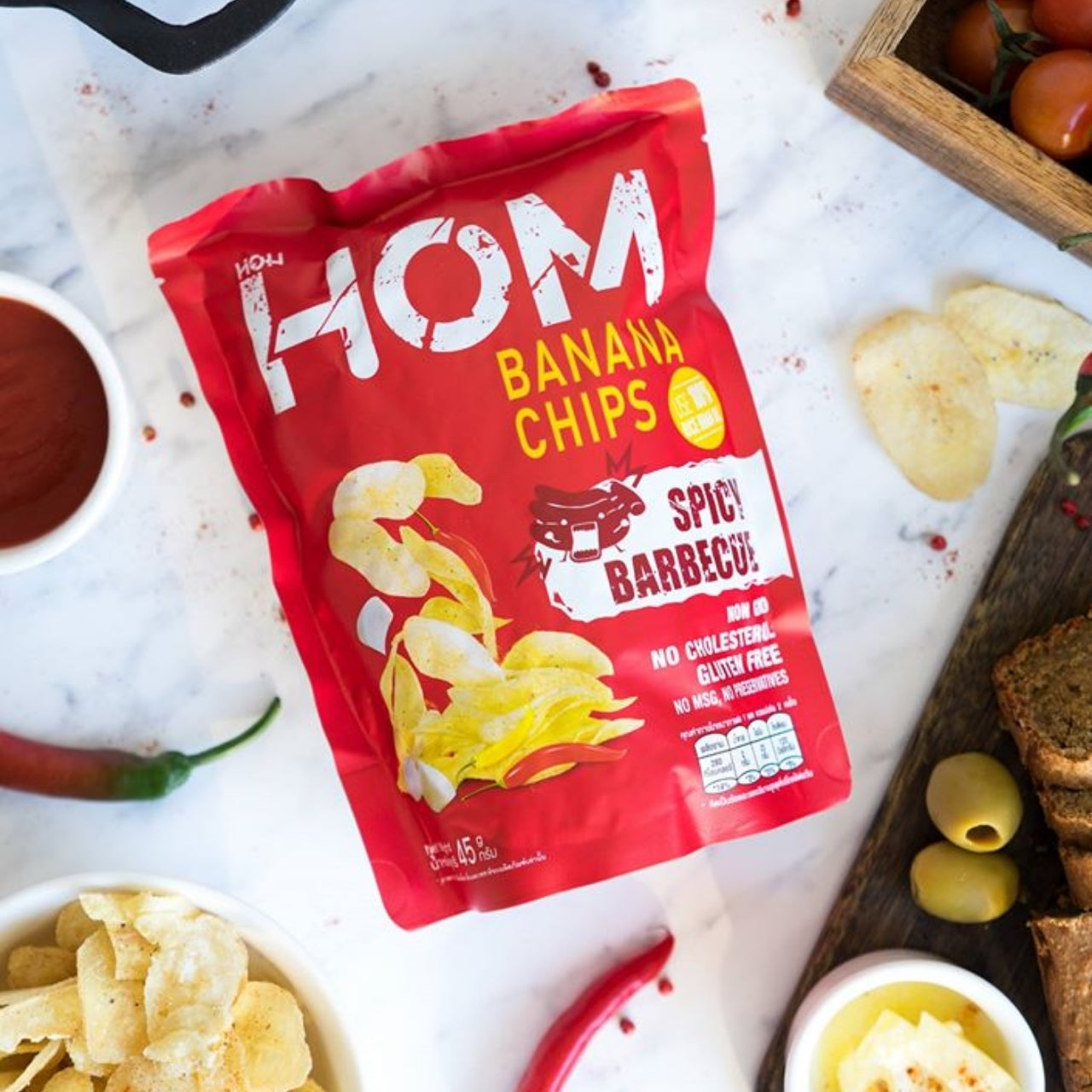 HOM Banana Chips Spicy BBQ Flavor – Crispy handpicked banana chips cooked in rice bran oil, seasoned with smoky and spicy barbecue flavors.