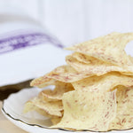 Sud Thang Puek Thin-Sliced Taro Chips – Crispy, aromatic taro chips expertly seasoned and freshly fried for a non-greasy, flavorful crunch.